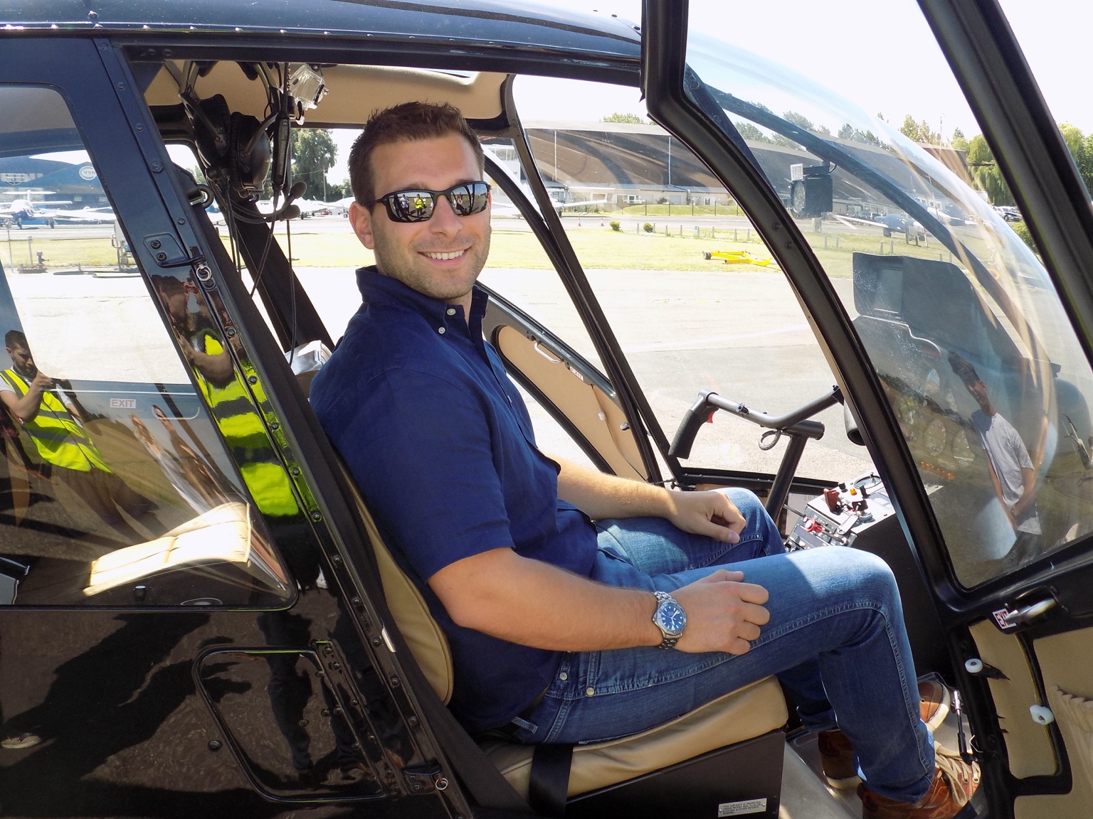 Luke Carter seated in a helicopter